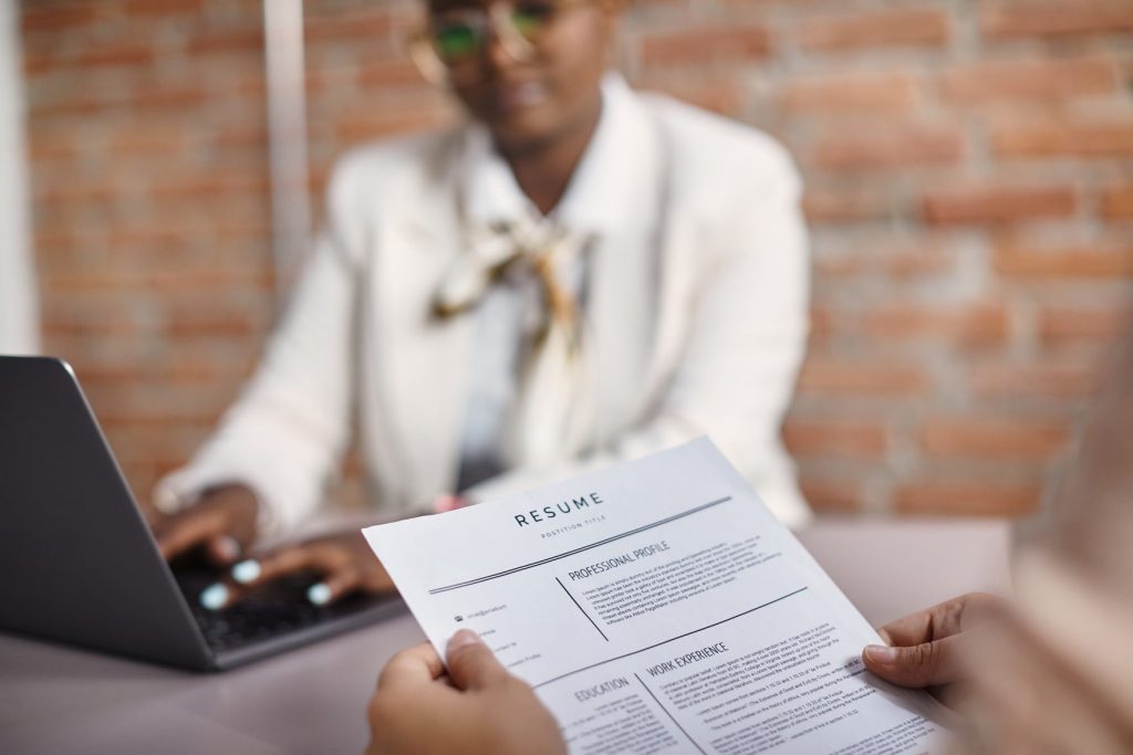 close up of job applicant holding her resume durin 2026 01 06 10 29 19 utc - How to Write a CV That Gets Interviews - Recruitment South Africa